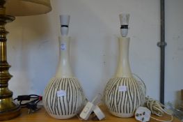 A pair of pottery table lamps.