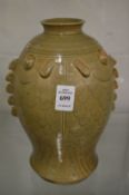 A Chinese fish shaped vase with incised decoration.