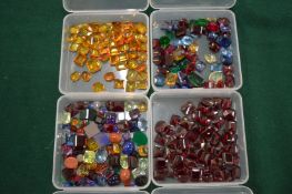 Four boxes of colourful stones.