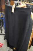 Various ladies black coloured garments.
