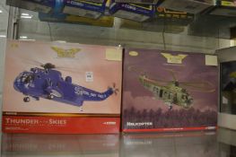 Two Corgi helicopter kits and a boxed military aviation set.