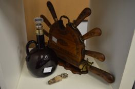 A knife set with carving knife and fork contained in a carved wood stand together with an amber