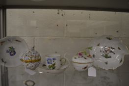 A collection of Herend porcelain to include a leaf shaped dish painted with birds on a branch, a cup