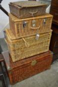 Four wicker baskets/hampers/trunks.