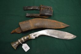 A Gurkha kukri with leather scabbard and belt hook.