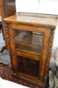 A Victorian walnut music cabinet.