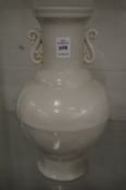 A Chinese large blanc de chine vase with S shaped handles.
