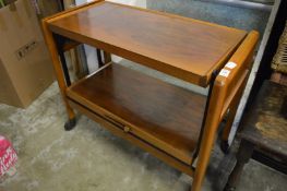 A walnut two-tier folding tea trolley.
