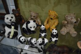 A collection of model teddy bears and panda bears.