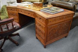 A large Chinese hardwood twin pedestal desk.