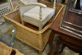 A large wicker dog bed.