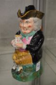An early toby jug with lid.
