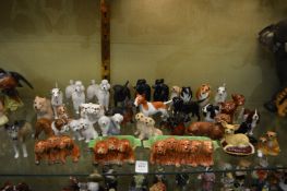 Beswick and other small porcelain models of dogs.