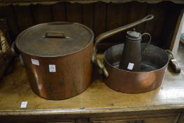 A large copper saucepan and lid, an open pan and a pot.