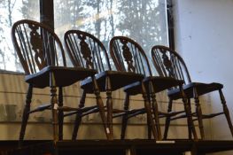A set of Windsor style single dining chairs.