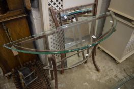 A stylish wrought iron and glass console table with matching mirror.