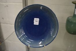 A Chinese blue glazed circular dish, the underside of the rim with incised decoration.