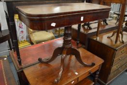 A 19th century mahogany fold-over tea table on pedestal base.