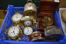 Various small clocks and a cased decorative compass.