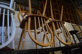 A set of four Ercol dining chairs.