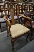 A George II style walnut armchair.