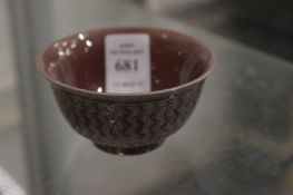 A Chinese small purple glazed bowl with incised decoration.