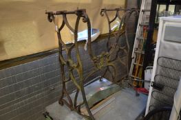 A cast iron sewing machine stand.