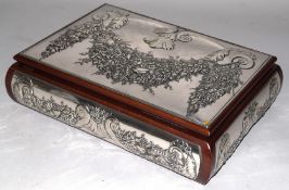 AN ITALIAN .921 SILVER BOX the wooden frame with embossed silver panels. 9.5in long x 7ins wide x