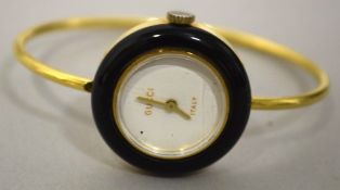 A LADIES GUCCI I TAR BRACELET WATCH with blue enamel border.