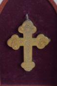 AN 18TH CENTURY RUSSIAN GILT METAL CRUCIFIX engraved with Christ on the cross, skull and crossbows