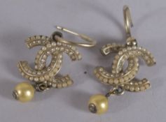 A PAIR OF CHANEL DOUBLE C AND PEARL EARRINGS.