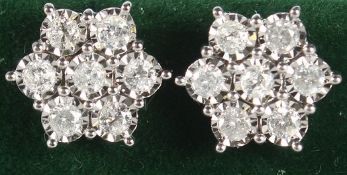 A PAIR OF 9CT GOLD 1CT DIAMOND DAISY EAR STUDS.