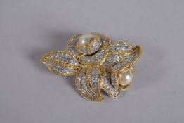 VOGUE A GILT METAL AND DIAMONTE FLOWER BROOCH