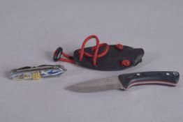 A VICTORINOX KNIFE 5.75ins long in a leather sheaf and an O/K ABEP Swiss knife.