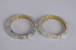 TWO ALEXIS BITTAR BANGLES with oval name plaque.