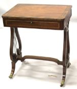 A GOOD REGENCY MAHOGANY WRITING TABLE with plain crossbanded top and fitted frieze drawer, with