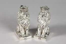 A PAIR OF ROYAL LION SALT AND PEPPERS.