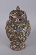 A HEAVY POTTERY MOSAIC PICASSIETTE FOLK ART URN AND COVER. 16ins high.