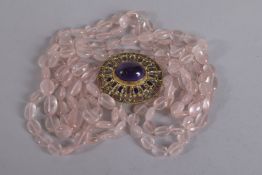 PERCOSSI PAPI POUR RAINIER A PINK QUARTZ NECKLACE and blue stone pendant, signed.