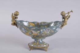 A PORCELAIN COAL BUCKET painted with flowers with ormolu cupid handles. 11ins high.