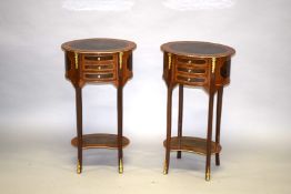A PAIR OF LOUIS XVI DESIGN OVAL BEDSIDE TABLES with three drawers, on slender curving legs and