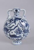 A CHINESE BLUE AND WHITE PORCELAIN TWIN-HANDLE MOON FLASK, with fish and algae. 27.5cms high.