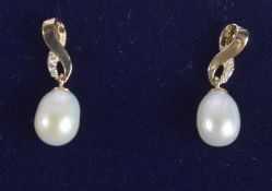 A PAIR OF 18CT GOLD PEAR AND DIAMOND DROP EARRINGS.