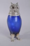 A LARGE SILVER PLATED NOVELTY BLUE GLASS OWL CLARET JUG.