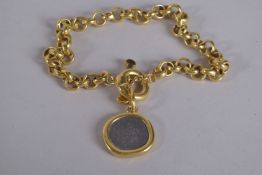 A CAROLEE GILT METAL CHOKER with a coin medallion, signed.