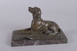 SALON DES BEAUX ARTS, PARIS. A FINE QUALITY PATINATED BRONZE FIGURE OF A HOUND SITTING ON A RUG,