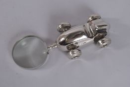 A NOVELTY CHROME MAGNIFYING GLASS 'OLD MOTOR CAR'