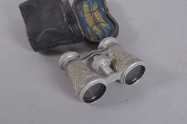 A PAIR OF CASED OPERA GLASSES.