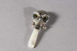 A SILVER NOVELTY OWL RATTLE.