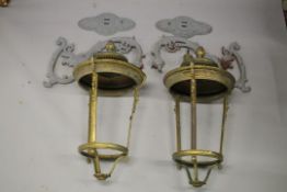 A PAIR OF LARGE BRONZE WALL LIGHTS, of tapering circular form, unglazed, complete with a pair of